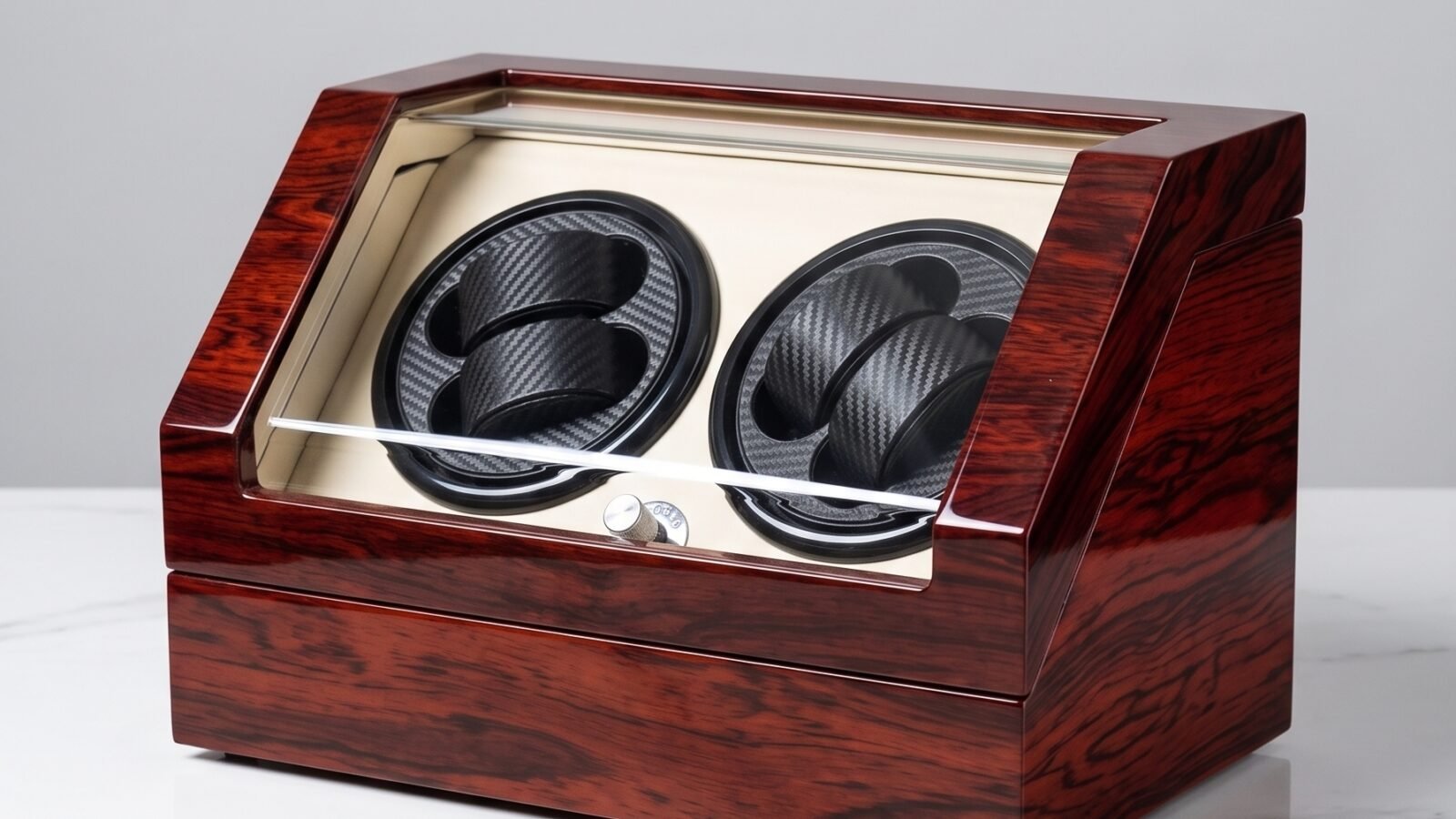 Red wood two-watch winder with an L-shaped acrylic front and two black carbon-fiber-pattern watch cushions