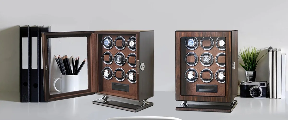 Two nine-slot walnut wood private label watch winder cabinets on a desk, one closed and one with its mirrored glass door open